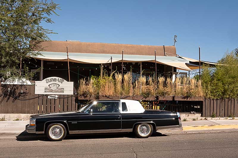 black car, Tune Up Cafe behind